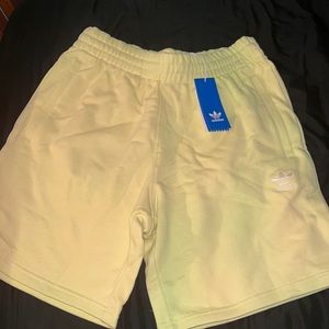 Selling never worn mens adidas shorts, yellow tint, they’re soft and look good!
